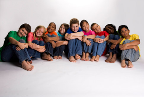 Image of nine children sitting on the floor
