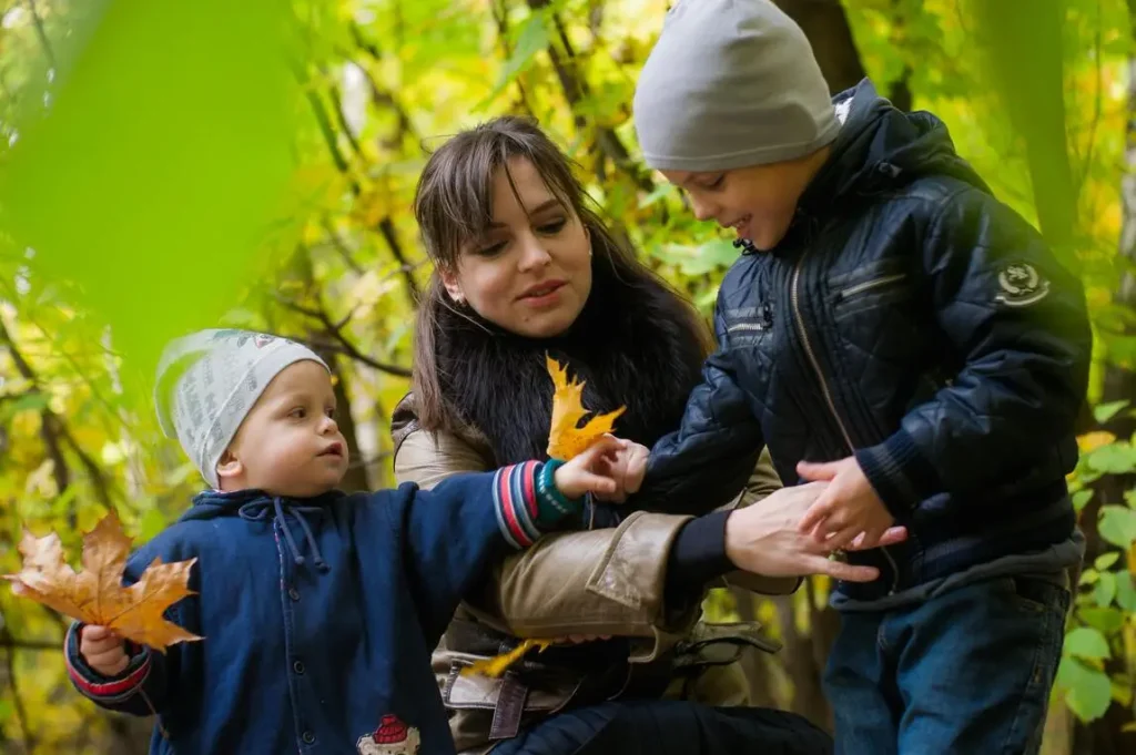 Adoptive kids with their mom playing outside